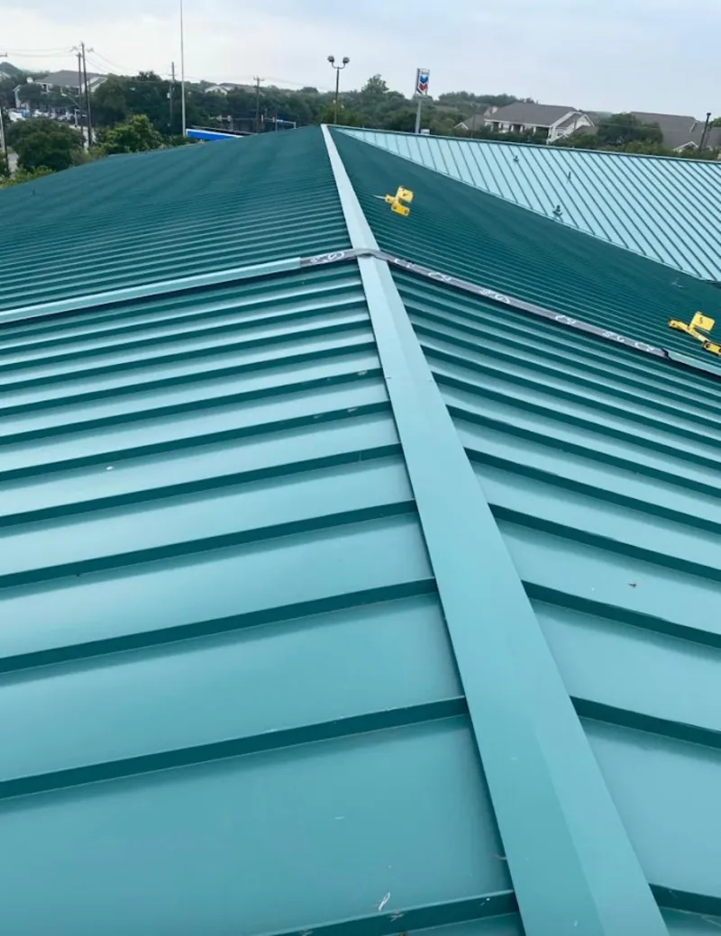Green commercial metal roof ridge and valley for Metal Roof Repair in Parkville